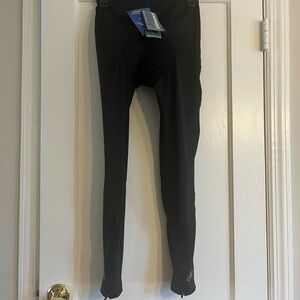 black cycling tights are from the brand Performance Wear